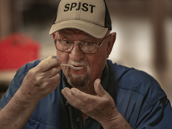 Barbecue beans judge Jesse Pospisil samples one of the entries during the BBQ Cook-off  on Saturday, May 13, 2023.