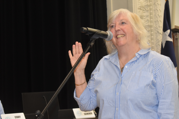 Trustee Stephanie Blanck restates her oath after being reelected.