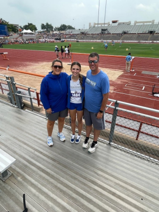 From left, Coach Jenny Richardson, long jumper Lily Muzzy, and Coach Corey Cunningham attend the State track meet in Austin.