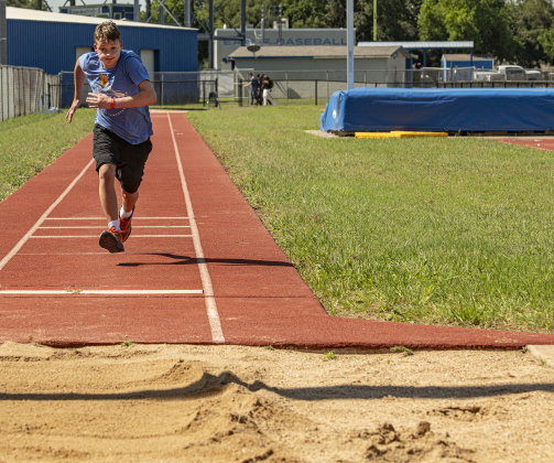 East View High student Zachary Brotzman, 15, competes in the long jump.