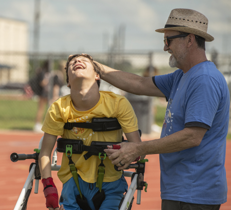 12-year-old Jack Ballard, left, a student at Wagner Middle School, is congratulated by Wagner teacher Clay Cansler after taking part in a bocce ball event. Cansler is the school district's Secondary School Teacher of the Year.