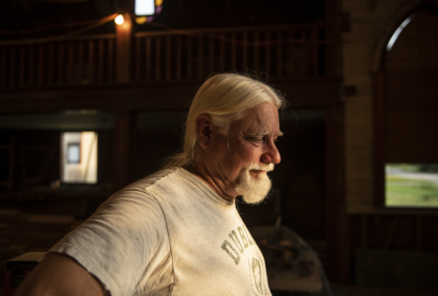 Robert Halstrom takes a moment to rest while continuing  his work at what was once Granger United Methodist Church on Monday, May 22.