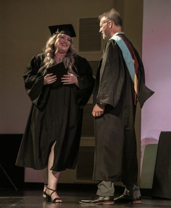 Richarte High School graduating senior Brooke Locklin, 17, proudly receives her diploma from principal Rob Dyer.
