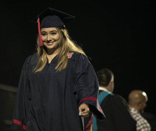 East View High School graduating senior Maria Guadalupe Salas Reyes smiles after receiving her diploma.
