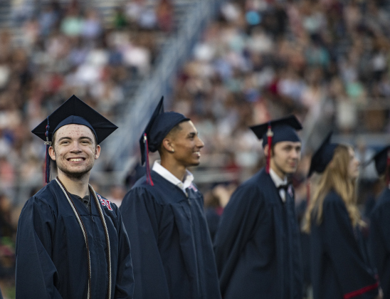 East View High School graduating senior Chance William Gaston, left, wears a big smile during the 2023 Commencement.
