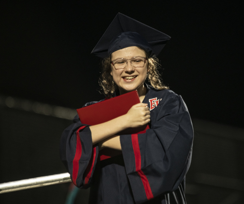 East View High School graduating senior Jenny Flemings hugs her diploma during the 2023 Commencement on Friday, May 26.