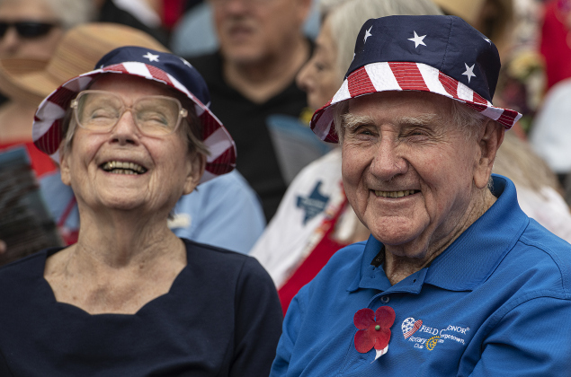 91-year-old friends  Rose Marie Dubois, left, and Phillip Baker, a U.S. Army veteran, wore matching hats to  the Sun City Texas Community Association Memorial Day observance held Monday, May 29 at the Georgetown-Williamson County Veterans Memorial Plaza in Sun City.
