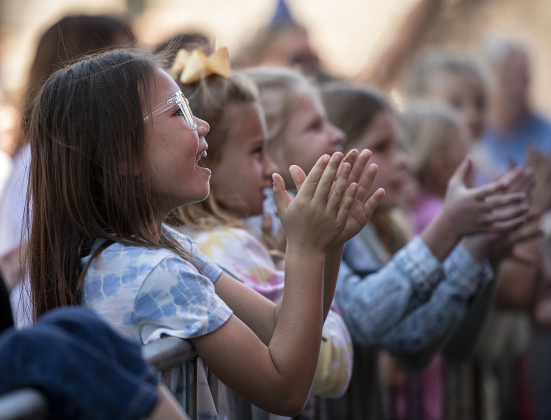 Johnny Rogers, 7, front left, joined members of her softball team to watch Georgetown's Allie Greiner perform with The Alibis.  Greiner's daughter Evie, 7, is a member of the team.  Allie had quite a few friends on hand to watch her sing.