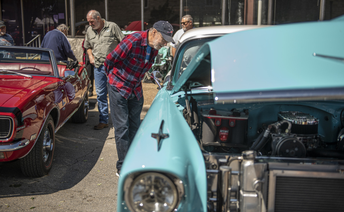 Dave Kull admires a 1956 Chevrolet Bel Air owned by Corky Lien.