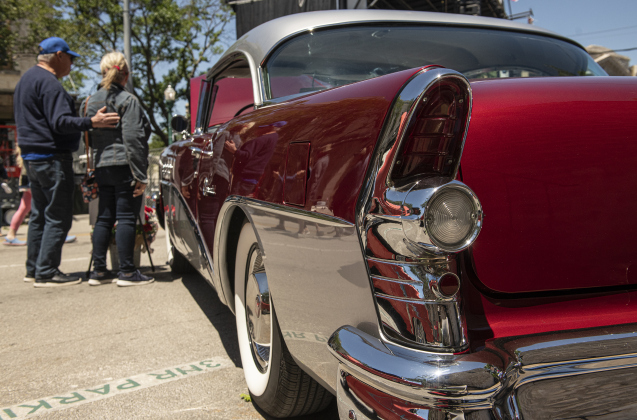 Mark Breyman and his wife Holly Noel stand near their 1955 Buick Special, a car show entry.