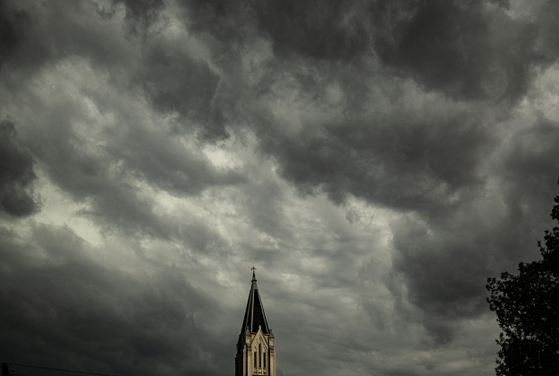 The spire at Georgetown's First United Methodist Church rests under layers of clouds on Friday evening, April 28, 2023.  Rain, accompanied by hail and high winds in some areas, moved through Williamson County throughout the evening.