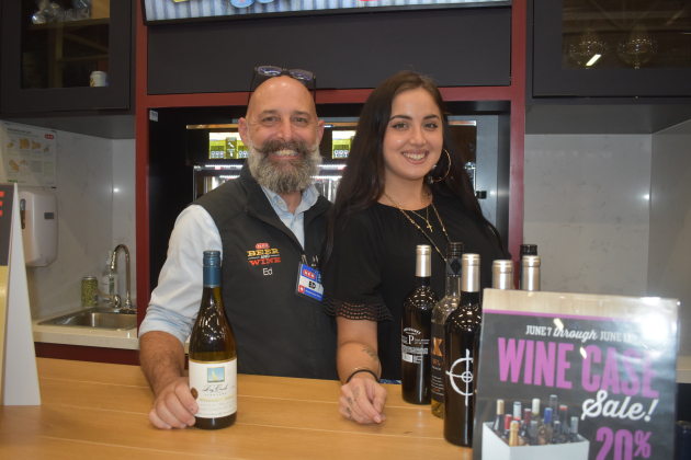 Beer and wine manager and 24-year H-E-B employee Ed Lindeman and Samantha Burge were happy to share samples Wednesday, June 7. Photo by Katherine Anthony