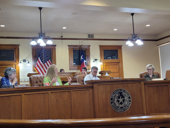 Williamson County Commissioners and County Judge Bill Gravell debate over an agenda item at Commissioner’s Court June 27. Photo by Nalani Nuylan.
