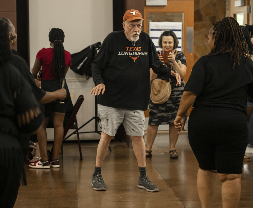 Frank Dunaway, center, joined in a dance with the Austin-based Smooth &amp; EZ Dance Company.