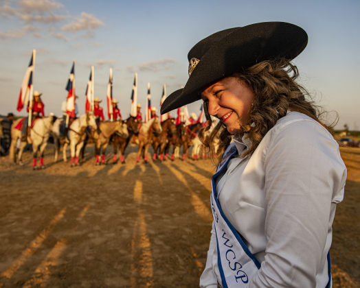 Ava Martinez, 16, is this year's Rodeo Sweetheart. Members of the rodeo drill team are pictured behind her..