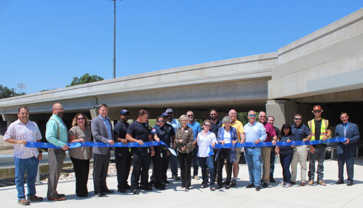 At the ribbon cutting, from left, were Oscar Salazar-Bueno, Whit Friend, Christen Eschberger, Scott Haywood with the Sam Bass Fire Department, Steven Shull, Precinct 3 Commissioner Valerie Covey, Tracy Cooper, Joelle Rosentswieg, William Sherwood, Precinct 1 Commissioner Terry Cook, Kim Filiatrault, Michael Tucker, Ken Reifschlager, Steven Waters, Janet Rubiano, Nester Rubiano, Aaron DeNucci, Richard Ridings.