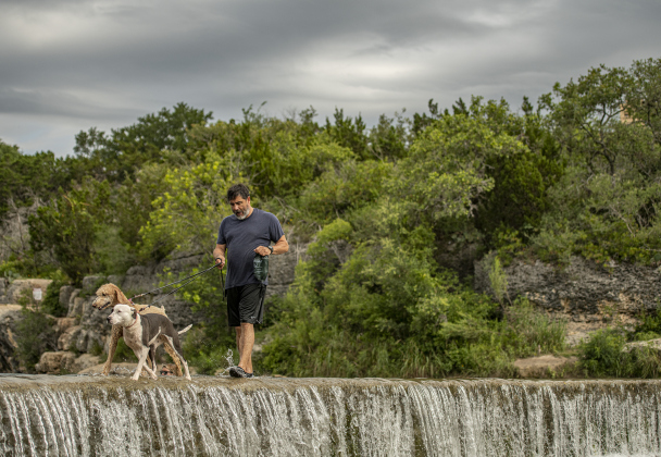 Michael Vidal and his dogs Zha Zha (front) and Tex spent some cooling-off.