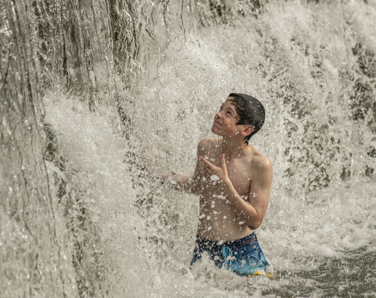 Jon Martinez, who was accompanied by his twin brother Jake and their parents, had fun beating the June heat at Blue Hole Park