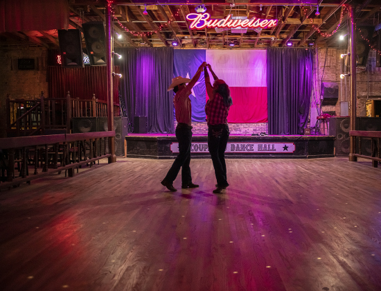 T.J. Schuler dances with Amber "Skittles" Griffith during a  dance class  at Coupland Dancehall on Sunday afternoon, June 4, 2023.   Griffith is the Coupland Dancehall General Manager.