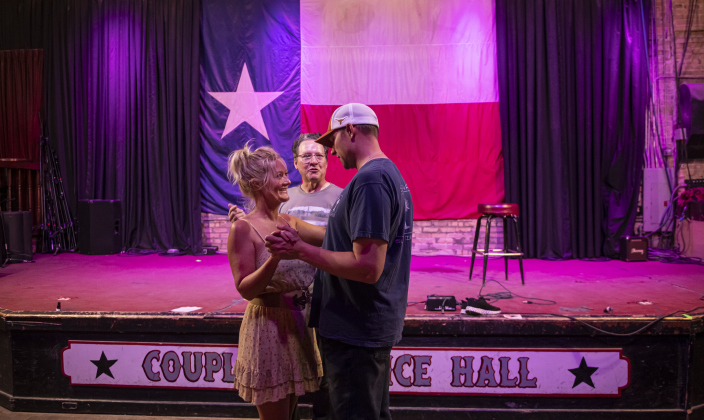 Russell Kinder,  center, owner (with his wife Erika)  of Coupland Dancehall, gives directions to Heather Humphrey and Eric Psencik.