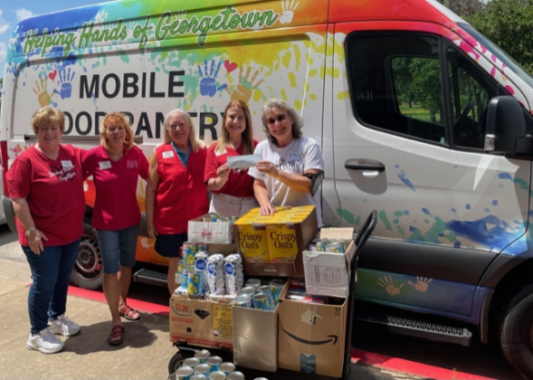 Pictured, from left, are Georgetown Area Junior Forum Members Jane Miller, Amanda Eisner, Anne Bustos and Diana Underwood, and Helping Hands of Georgetown staff member Cara Skinner. Photos courtesy the Georgetown Area Junior Forum.