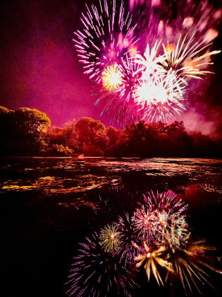 The Sertoma Club of Georgetown’s fireworks show lights up the sky and colorfully reflects on the San Gabriel River Tuesday, July 4. Photo by Russell Vargo