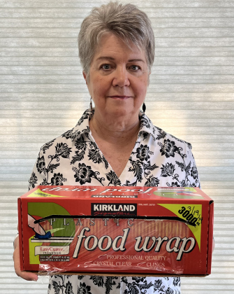 Linda Dwyer holds a Kirkland cling wrap boxes. The box is dated March 2014 to show how long it has lasted