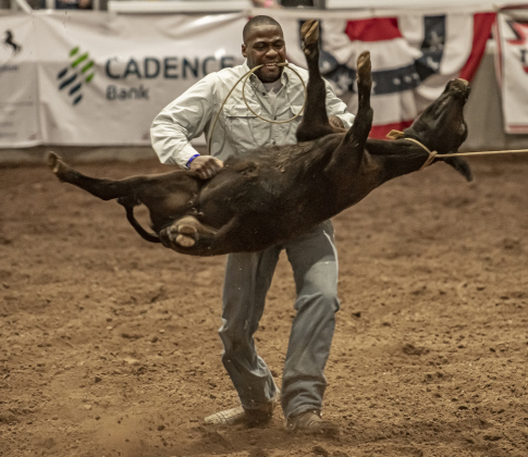 Pat Hooper of Athens, Texas competes in Steer Wrestling.