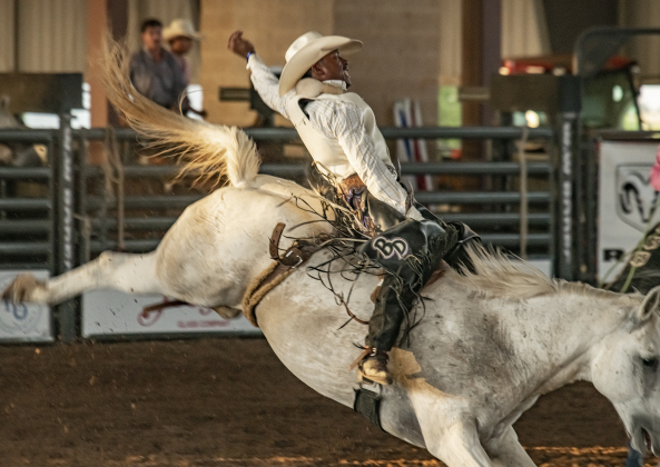 Blaine Dever of Houston competes in Bareback Riding.