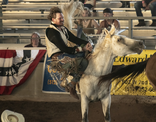 Justin Lewis of Kirbyville, Texas competes in  Bareback Riding.