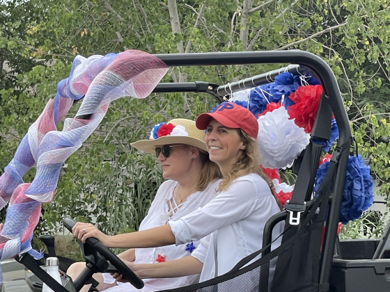 Grace Pyka drives a golf cart with Council Member Amanda Parr during the Old Town parade. Photo courtesy Amanda Parr