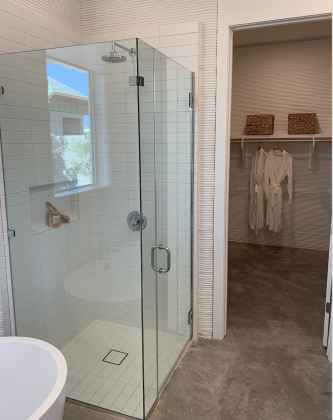 The primary bathroom has an attached walk-in closet and both a separate bathtub and shower.