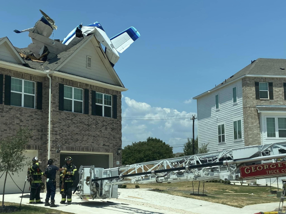 A plane sits at the top of a Georgetown home Sunday, July 23.  Photo courtesy Georgetown Fire Department 