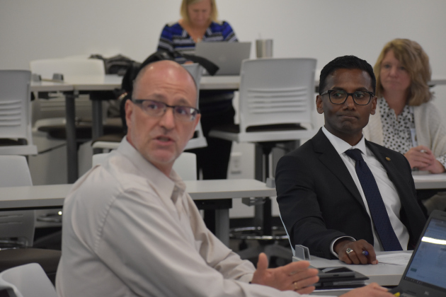 Diving right into GISD business at a board workshop, Mr. Padavil listens to a report about a possible future bond election. The presenter is Chief Strategist Lannon Heflin.