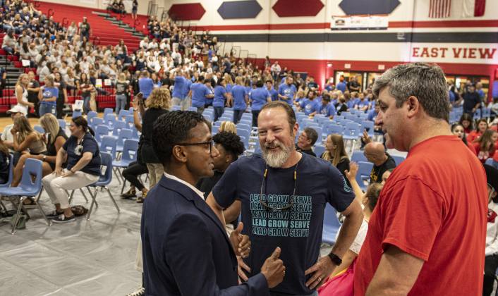 Devin Padavil, left, the new superintendent for the Georgetown ISD, chats with School Board Trustee Cody Hirt, center, and East View High School Assistant Principal Cory Schrader, right, during a convocation for teachers and staff held in the East View High School gymnasium on Tuesday, August 8, 2023. Photo by Andy Sharp