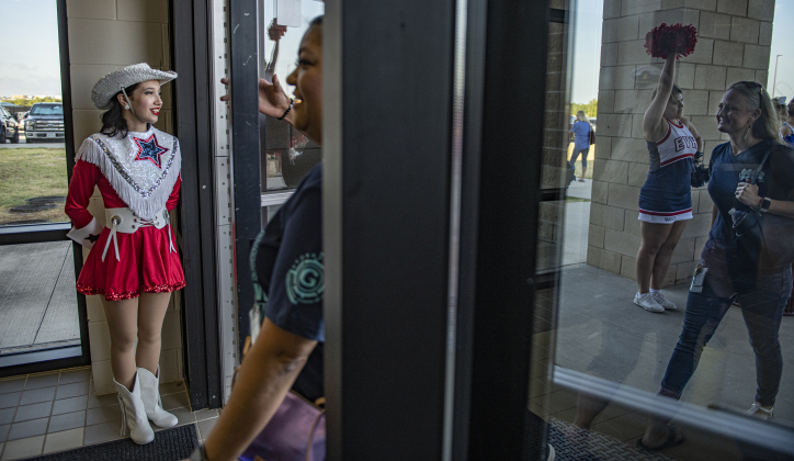 East View High senior Lauren Cuevas, left, a member of the Sparklers dance team, was among those welcoming attendees. Photo by Andy Sharp.