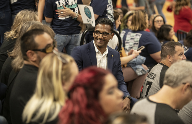 Devin Padavil, center, the new superintendent for Georgetown ISD, chats  with teachers and staff during a convocation held in the East View High School gymnasium on Tuesday, August 8. Photo by Andy Sharp.