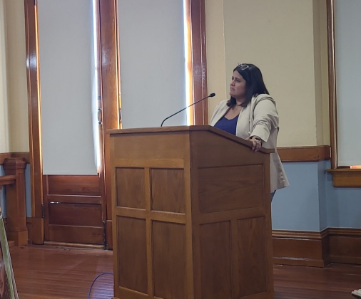 Interim Elections Administrator Judith Ritchie stands at the podium August 15. Photo by Nalani Nuylan