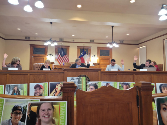 Williamson County Elections Commission votes to approve Judith Ritchie as Interim Elections Administrator during the August 15 meeting. A display from a meeting earlier in the day stands in front of the court dais.