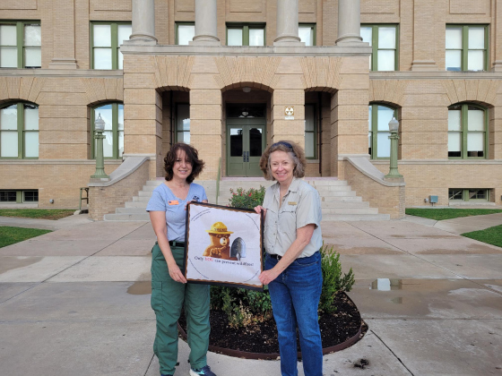 Texas A&M Public Information Officers Leslie Auriemmo (Left) and Besty Coffee (right) were walking on Georgetown Square sharing tips on how to prevent wildfires on August 10.  Photo by Nalani Nuylan. 