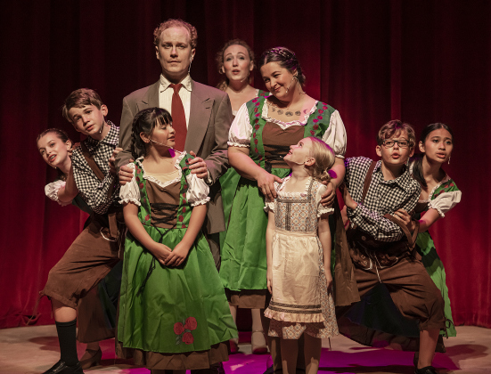Creighton Moench, top left, as Captain Georg Von Trapp, and  Cassidy Thompson, adult at right,  as Maria Rainer, are pictured with actors playing the Von Trapp children, including (left to right) Jordyn Bauer (Brigitta), Sean Condon (Friedrich), Coco Taylor-Castro ( Marta), Kelsey Hughen ( Liesl) Ellie Jackson (Gretl), William Reeves (Kurt) and Lillian Gabrillo (Louisa) in a Thursday, August 17, 2023 scene from the Georgetown Palace production of "The Sound of Music," playing on the Springer Stage through S