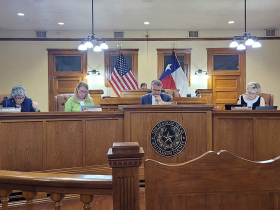 The Williamson County Commissioners Court discusses an item on the August 22 agenda. Photo by Nalani Nuylan.