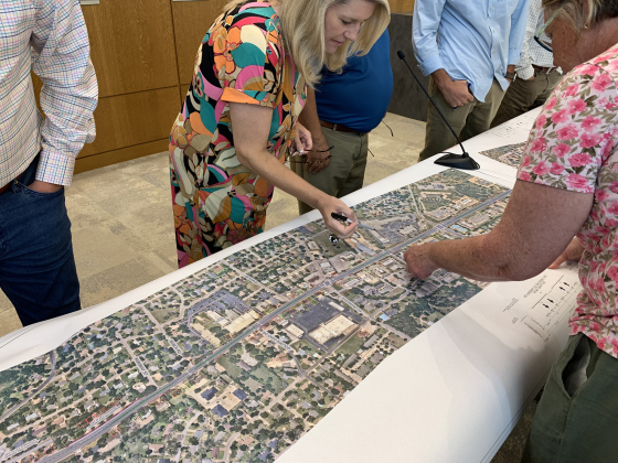 Council Member Amanda Parr and Georgetown residents examine a map of Williams Drive presented to the city council on August 22. (Photo by Kaitlyn Wilkes)
