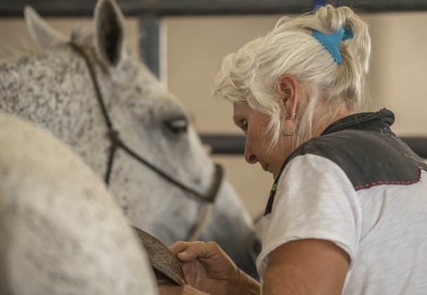 Joni Gabriel of Lockhart spends time with her horse named Batman before they competed in Ladies Breakaway Roping.