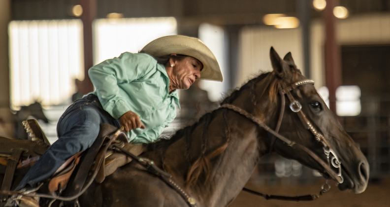 Tami Burkand of Lexington, Texas competes in Barrel Racing.