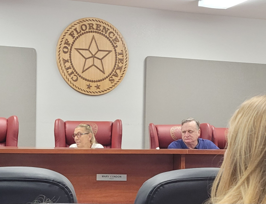 Florence City Mayor Mary Condon (left) listens to a resident’s comments during the August 1 City Council meeting. Photo by Nalani Nuylan.