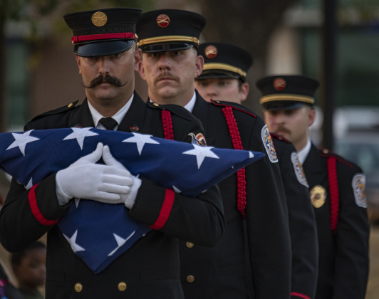 Members of the Taylor Honor Guard prepare to post the colors at Heritage Square Park during Taylor's Patriot Day observance on Monday, September 11, 2023.