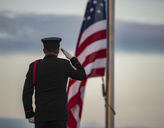 Taylor Honor Guard Commander Tim Davis salutes for the posting of the colors  during Taylor's Patriot Day observance on Monday, September 11, 2023.