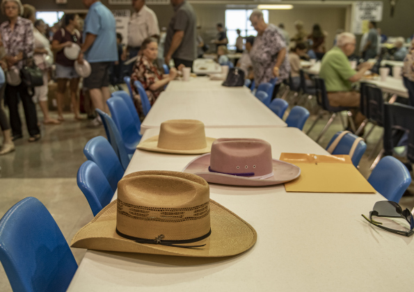 A family used their cowboy hats to mark their seating places for lunch.