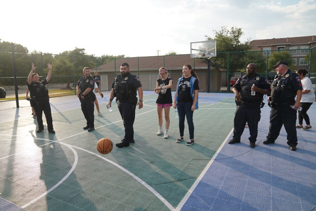 Cedar Park Police officers play basketball at a Cedar Park apartment complex during the department’s National Night Out on August 1, 2023. Photo Courtesy of Cedar Park Police.